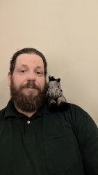 Marc with Baby Hiccup the toy horse on his shoulder
