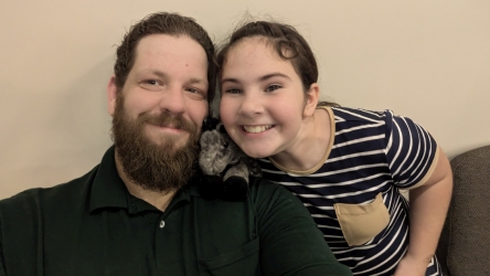 Marc, Miss Anna, and Baby Hiccup smiling for the camera