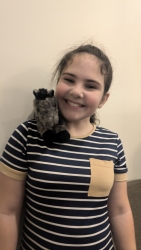 Miss Anna with Baby Hiccup on her shoulder