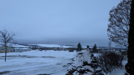Looking out the door of the hall before leaving