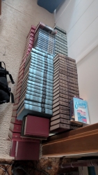 Commentary books lined along the spare room wall.