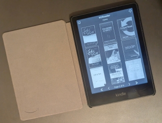 Kindle open to a library view showing multiple books ready to read.